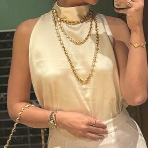 Chic Cream Sleeveless Blouse